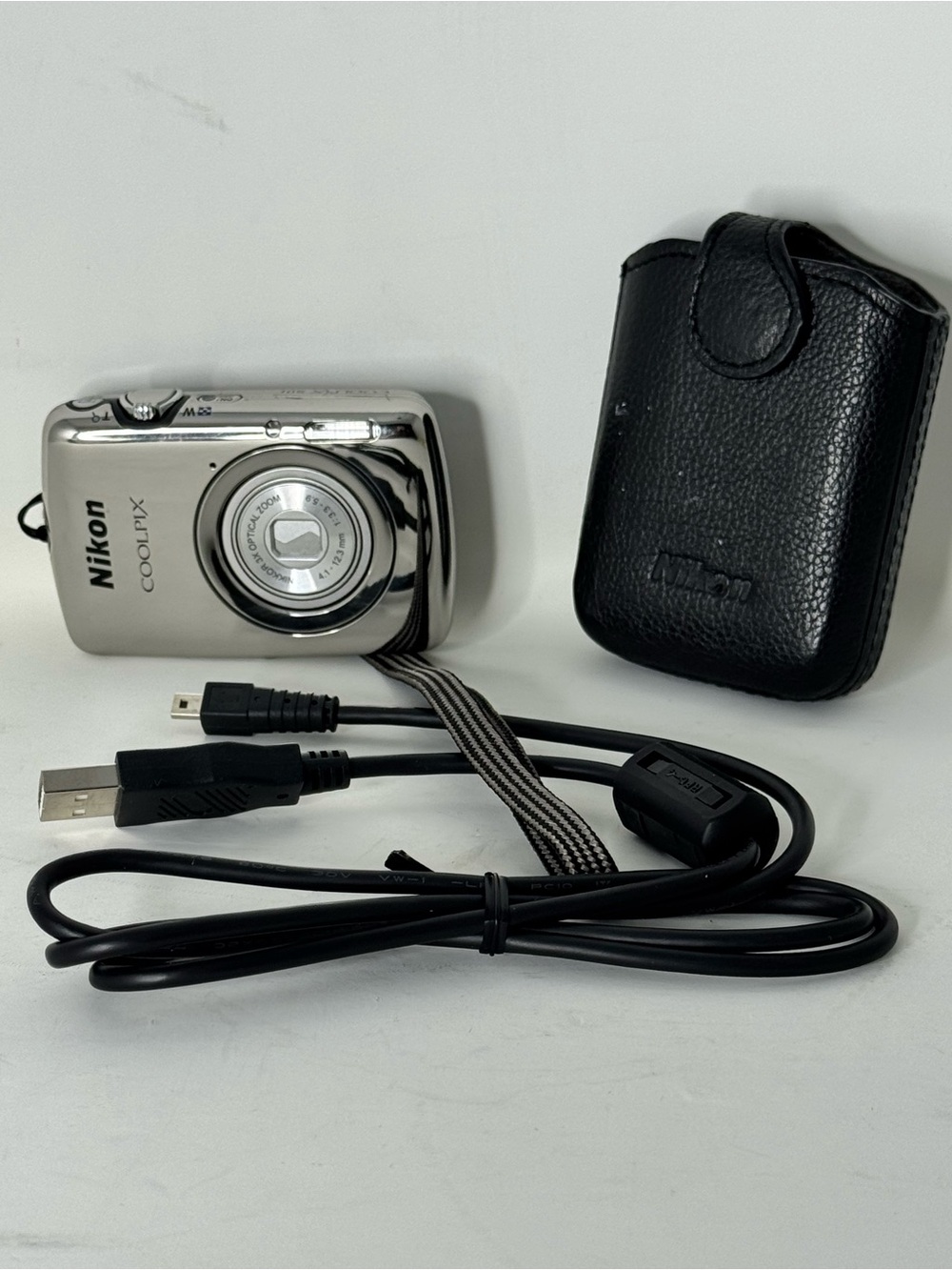 Nikon COOLPIX Silver Point-and-Shoot Camera with Black Case with charger cable